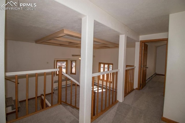 2324 W Willamette Ave, Colorado Springs, CO 80904 - corridor with carpet floors, a textured ceiling, an upstairs landing, and beamed ceiling