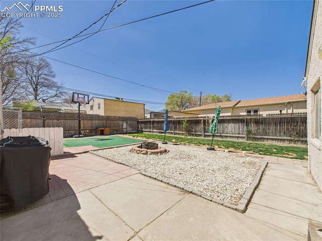 view of patio / terrace featuring a fenced backyard and a fire pit