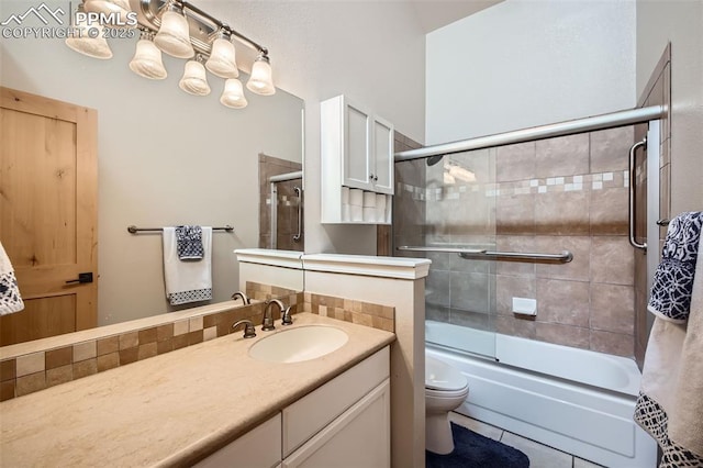 440 Scrub Oak Cir, Monument, CO 80132 - bathroom with toilet, bath / shower combo with glass door, tile patterned flooring, and vanity