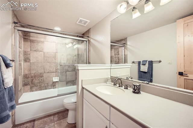 440 Scrub Oak Cir, Monument, CO 80132 - bathroom with toilet, vanity, shower / bath combination with glass door, and stone finish floors