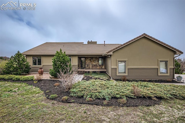 440 Scrub Oak Cir, Monument, CO 80132 - rear view of house featuring a tiled roof and stucco siding
