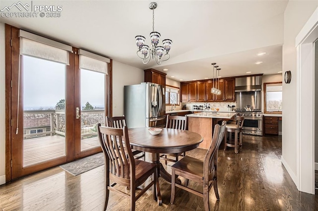 440 Scrub Oak Cir, Monument, CO 80132 - dining space with healthy amount of natural light, dark wood finished floors, a chandelier, recessed lighting, and baseboards