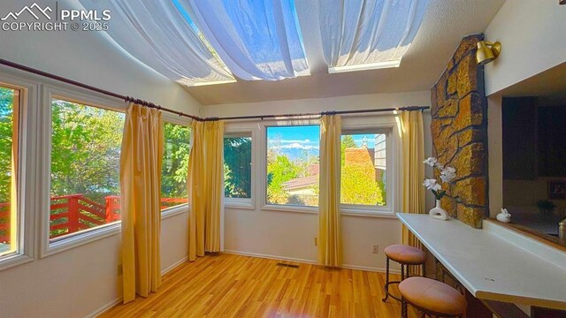 5125 Thistle Ct, Colorado Springs, CO 80917 - sunroom / solarium with healthy amount of natural light and vaulted ceiling