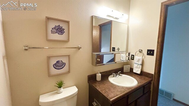 5125 Thistle Ct, Colorado Springs, CO 80917 - half bath featuring vanity and toilet