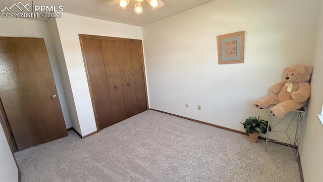 5125 Thistle Ct, Colorado Springs, CO 80917 - unfurnished bedroom with carpet flooring, a closet, baseboards, and a textured ceiling