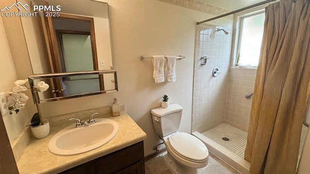 5125 Thistle Ct, Colorado Springs, CO 80917 - bathroom with a stall shower, toilet, and vanity