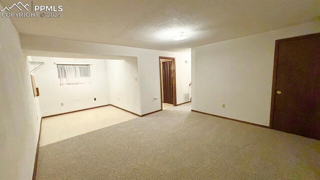 5125 Thistle Ct, Colorado Springs, CO 80917 - carpeted spare room with baseboards and a textured ceiling