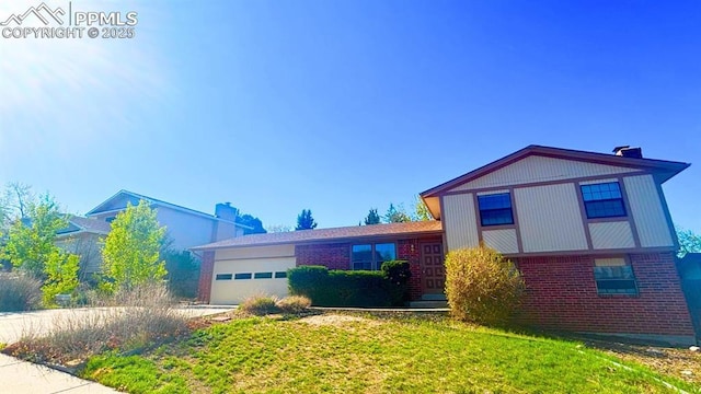5125 Thistle Ct, Colorado Springs, CO 80917 - view of front of property featuring brick siding, a chimney, and a garage