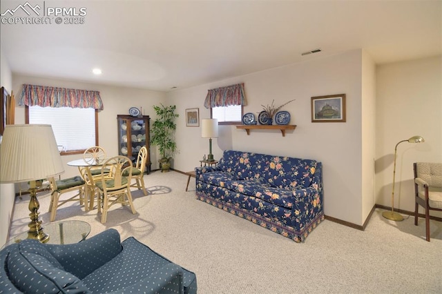 living area featuring visible vents, recessed lighting, carpet, and baseboards