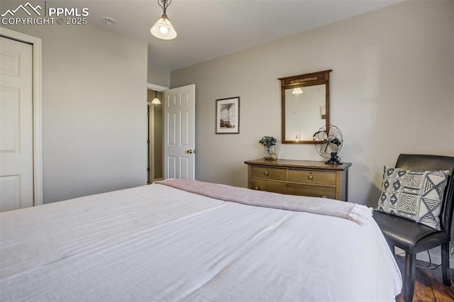 bedroom featuring wood finished floors