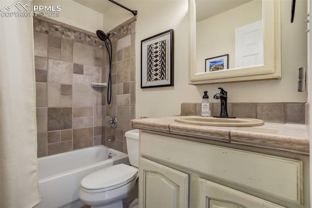 bathroom featuring toilet, vanity, and shower / bath combo with shower curtain