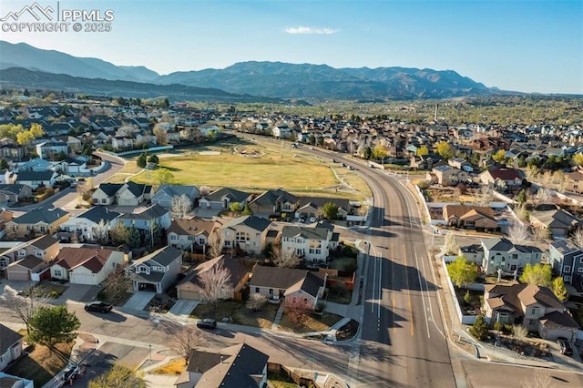 drone / aerial view featuring a residential view and a mountain view