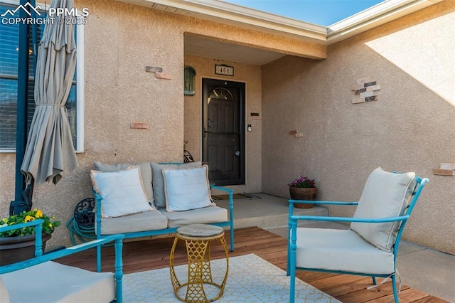 view of exterior entry with stucco siding