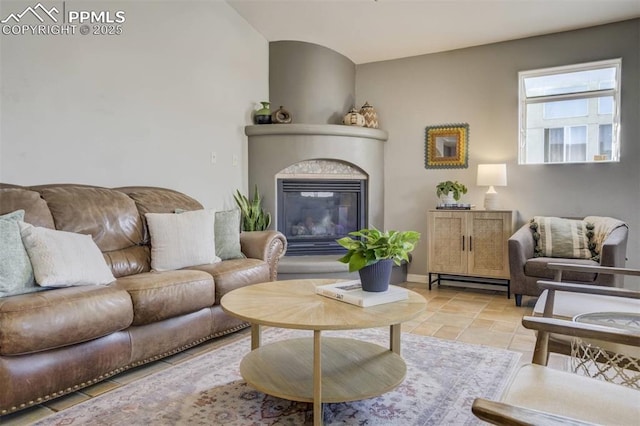 living room with a glass covered fireplace