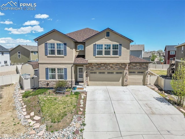 view of front of property featuring stone siding, an attached garage, driveway, and stucco siding