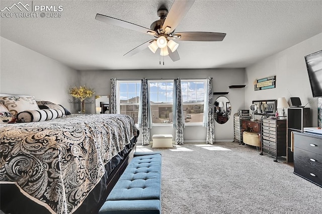 carpeted bedroom featuring a textured ceiling and a ceiling fan