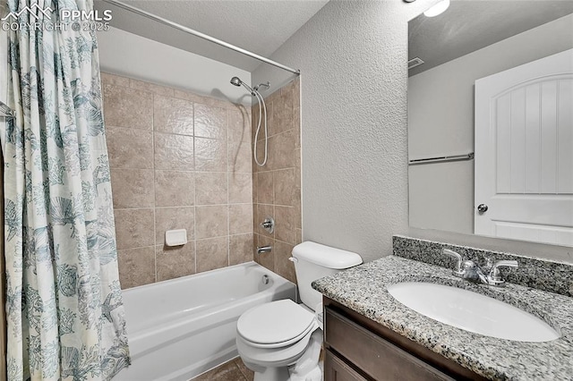 bathroom with a textured wall, vanity, shower / bathtub combination with curtain, and toilet