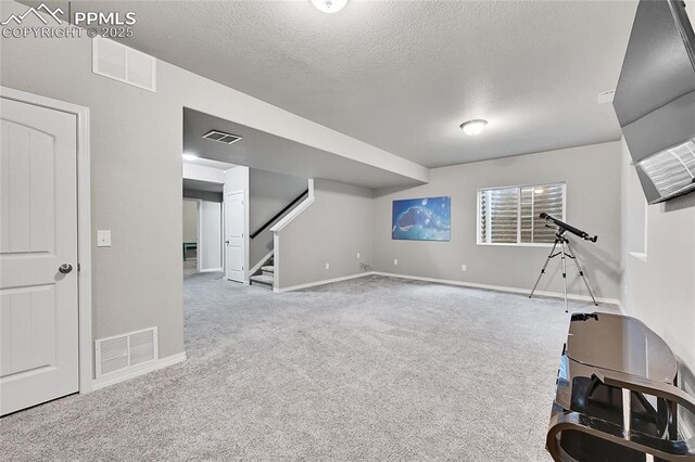 interior space featuring carpet and visible vents