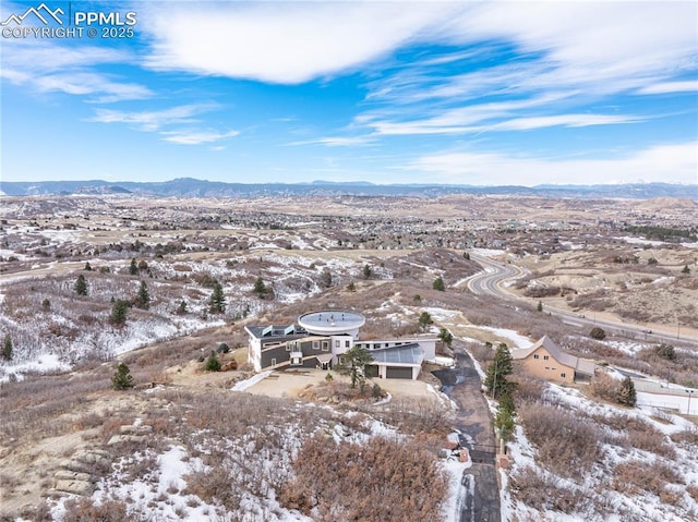 1175 Ridge Oaks Dr, Castle Rock, CO 80104 - snowy aerial view with a mountain view