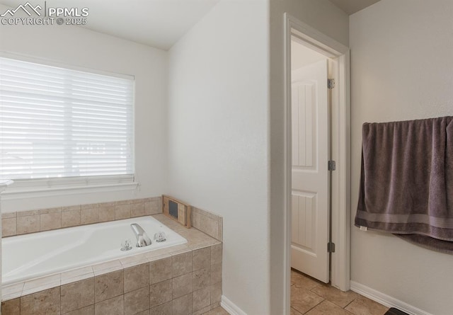 6117 Hayfield Pl, Colorado Springs, CO 80925 - bathroom with baseboards, tile patterned flooring, and a garden tub