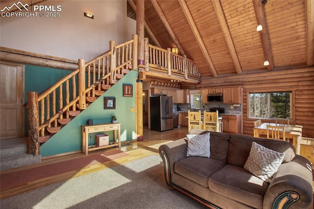 876 Obsidian Dr, Florissant, CO 80816 - living area with high vaulted ceiling, wooden ceiling, a wealth of natural light, and rustic walls