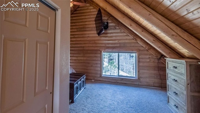 876 Obsidian Dr, Florissant, CO 80816 - interior space with carpet floors, lofted ceiling with beams, wood ceiling, and rustic walls