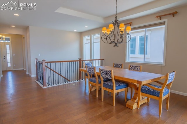 1474 Promontory Bluff Vw, Colorado Springs, CO 80921 - dining room featuring a chandelier, wood finished floors, plenty of natural light, recessed lighting, and baseboards