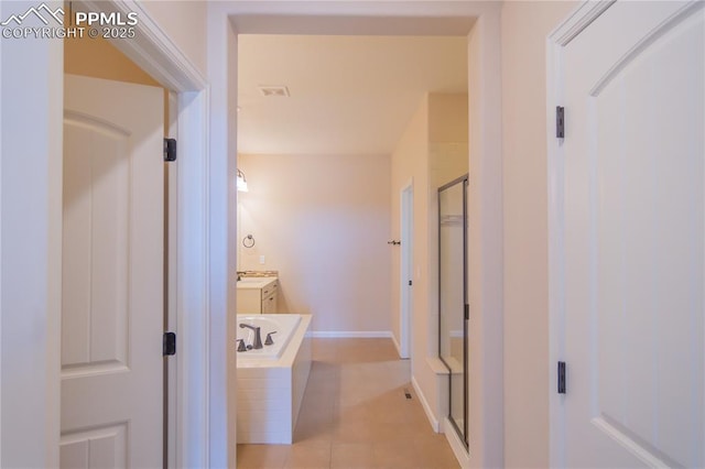 1474 Promontory Bluff Vw, Colorado Springs, CO 80921 - hall featuring baseboards and light tile patterned flooring