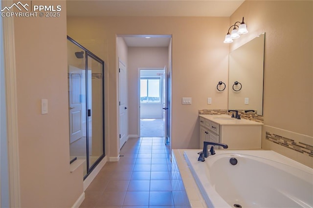 1474 Promontory Bluff Vw, Colorado Springs, CO 80921 - full bath with a bath, a stall shower, vanity, tile patterned flooring, and baseboards