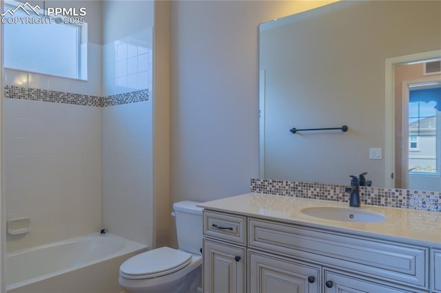 1474 Promontory Bluff Vw, Colorado Springs, CO 80921 - bathroom featuring toilet, vanity, decorative backsplash, and washtub / shower combination