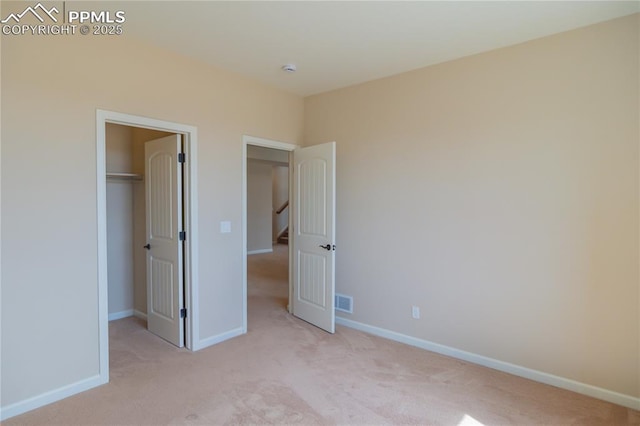 1474 Promontory Bluff Vw, Colorado Springs, CO 80921 - unfurnished bedroom with light colored carpet, baseboards, a spacious closet, and a closet