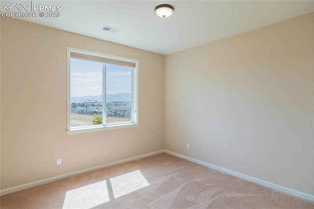 1474 Promontory Bluff Vw, Colorado Springs, CO 80921 - spare room featuring baseboards and light colored carpet