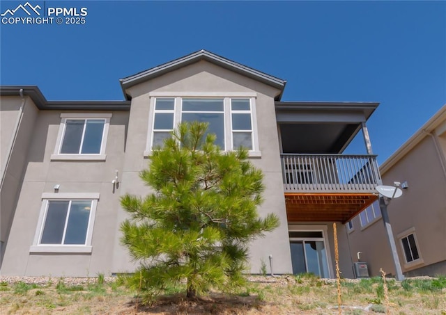 1474 Promontory Bluff Vw, Colorado Springs, CO 80921 - rear view of property with stucco siding, central air condition unit, and a balcony