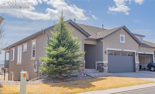 1474 Promontory Bluff Vw, Colorado Springs, CO 80921 - view of front of property featuring stucco siding, an attached garage, driveway, a front lawn, and stone siding