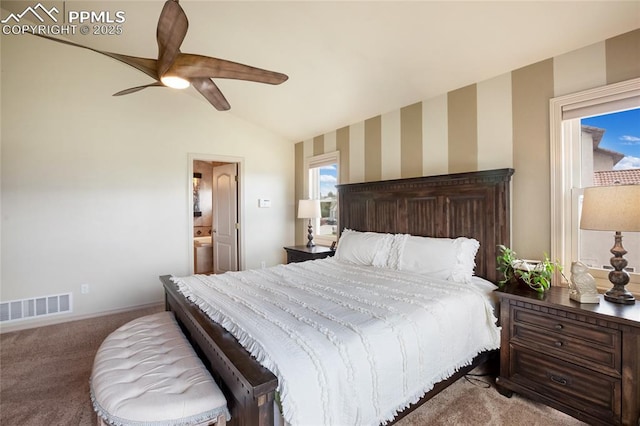 15090 Jessie Dr, Colorado Springs, CO 80921 - carpeted bedroom featuring vaulted ceiling, ceiling fan, wallpapered walls, and connected bathroom
