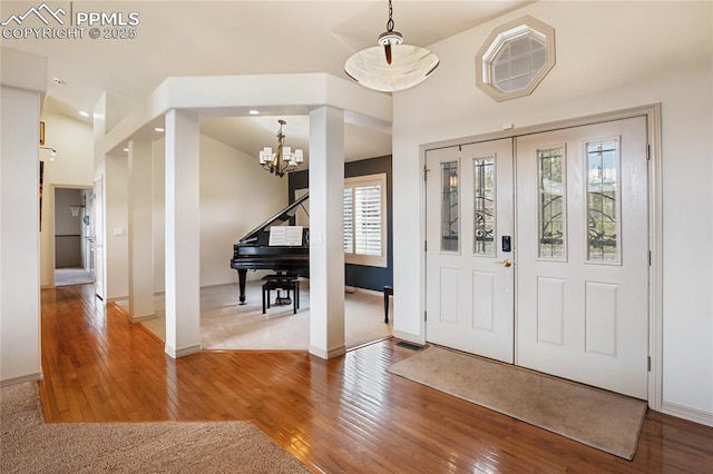 15090 Jessie Dr, Colorado Springs, CO 80921 - entryway with a chandelier, baseboards, wood finished floors, and recessed lighting
