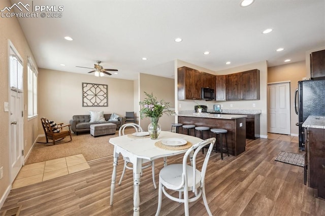 dining area featuring recessed lighting, wood finished floors, visible vents, and baseboards