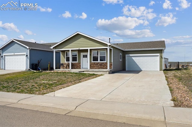 ranch-style home featuring a garage, covered porch, and concrete driveway