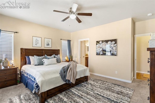 1185 Antrim Loop, Colorado Springs, CO 80910 - carpeted bedroom featuring ensuite bathroom, baseboards, and ceiling fan