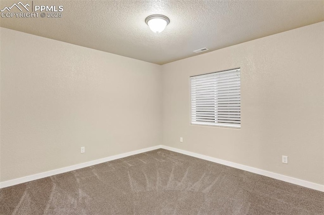 1185 Antrim Loop, Colorado Springs, CO 80910 - carpeted empty room featuring visible vents, baseboards, and a textured ceiling