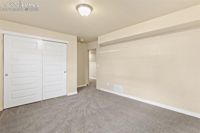 1185 Antrim Loop, Colorado Springs, CO 80910 - unfurnished bedroom featuring visible vents, a closet, baseboards, and carpet floors