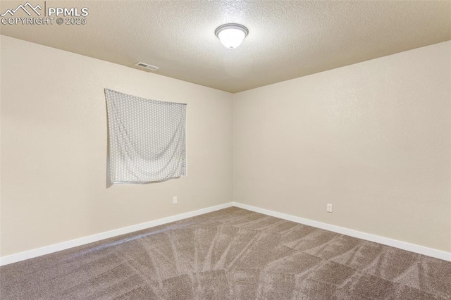 1185 Antrim Loop, Colorado Springs, CO 80910 - spare room with a textured ceiling, baseboards, visible vents, and carpet floors