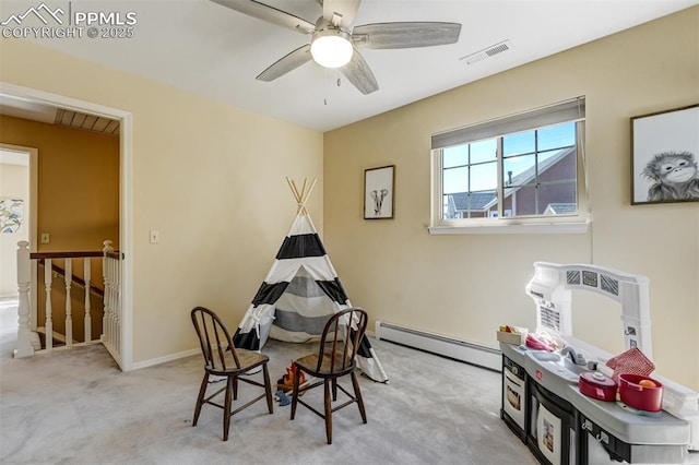 660 Pony Ln, Colorado Springs, CO 80904 - rec room featuring baseboard heating, baseboards, carpet flooring, a ceiling fan, and visible vents