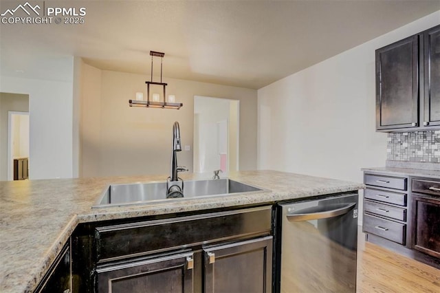 7935 Morning Dew Rd, Colorado Springs, CO 80908 - kitchen with a sink, light countertops, and dishwasher