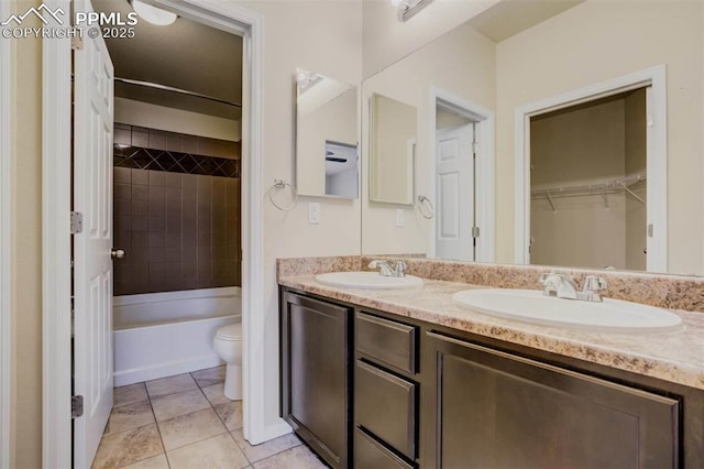 7935 Morning Dew Rd, Colorado Springs, CO 80908 - full bath with tile patterned floors, double vanity, a sink, and toilet