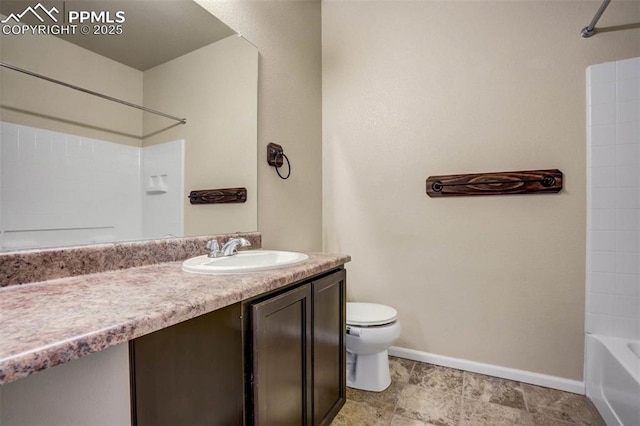 7935 Morning Dew Rd, Colorado Springs, CO 80908 - full bathroom featuring toilet, vanity, baseboards, and tub / shower combination