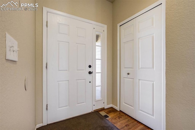7935 Morning Dew Rd, Colorado Springs, CO 80908 - entrance foyer with visible vents, baseboards, and wood finished floors