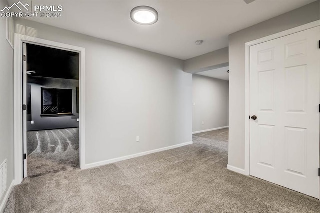 7935 Morning Dew Rd, Colorado Springs, CO 80908 - carpeted empty room featuring visible vents and baseboards