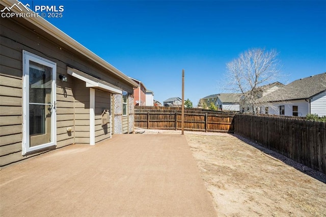 7935 Morning Dew Rd, Colorado Springs, CO 80908 - view of yard with a fenced backyard, a residential view, and a patio