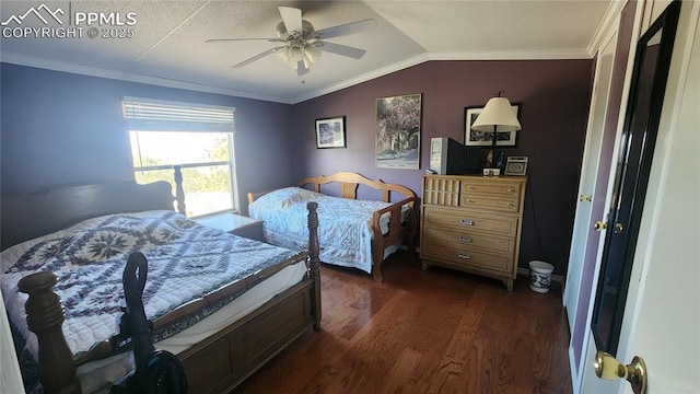bedroom featuring dark wood-type flooring, lofted ceiling, crown molding, and a ceiling fan